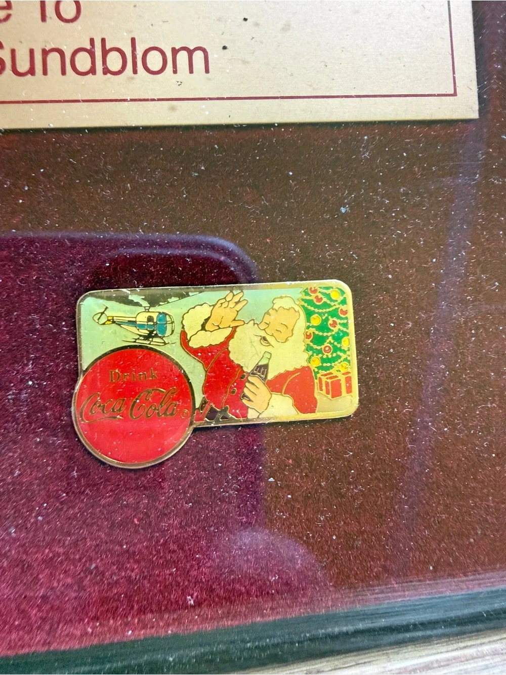 Coca-Cola Holiday Pin Tribute Display in Red and Gold